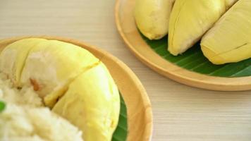 Durian with sticky rice -  sweet durian peel with yellow bean, Ripe durian rice cooked with coconut milk - Asian Thai dessert summer tropical fruit food video