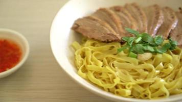 dried duck noodles in white bowl  - Asian food style video