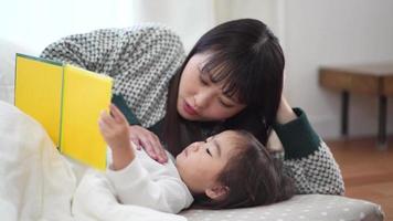 Parents and children reading picture books