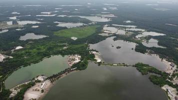 Aerial view Kampat abandoned tin mining lake video