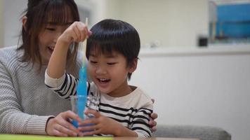 Parent and child making slime video