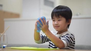 Boy playing with slime video