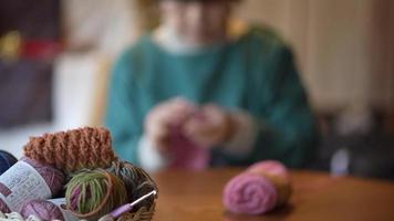 Image of a woman knitting video