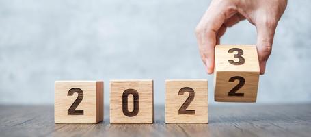hand flip 2022 to 2023 block. goal, Resolution, strategy, plan,, motivation, reboot, forecast, change, countdown and New Year holiday concepts photo