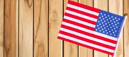 United States of America flag on wooden table background. USA holiday of Veterans, Memorial, Independence and Labor Day concept photo
