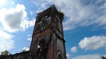 Gimbal view dilapidated church in hot day video