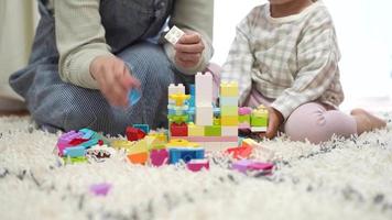 Parents and children playing with blocks video