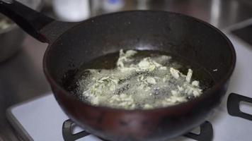 Woman frying tempura of cod buds video