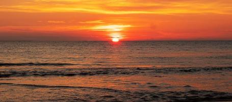 Beautiful sunset over ocean. Seascape and cloudscape concept photo