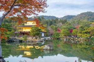 Beautiful of Kinkakuji temple or the golden Pavilion in Autumn foliage season, landmark and famous for tourist attractions in Kyoto, Kansai, Japan photo