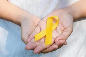 Suicide prevention, Sarcoma, bone, bladder, Childhood cancer Awareness month, Yellow Ribbon for supporting people living and illness. children Healthcare and World cancer day concept photo