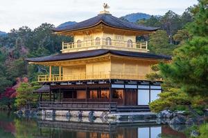 Beautiful of Kinkakuji temple or the golden Pavilion in Autumn foliage season, landmark and famous for tourist attractions in Kyoto, Kansai, Japan photo