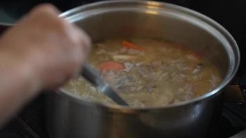 Women's hands making pork soup video