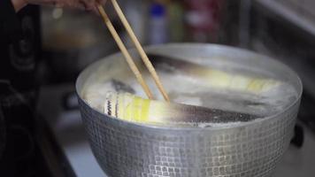 A woman boiling bamboo shoots video