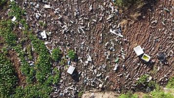 Aerial descending look down rubbish plastic pollution video