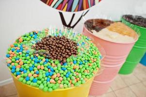 Barrels with sweets in candy shop. photo