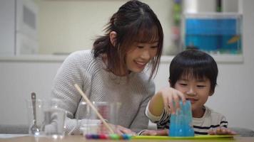 Parent and child making slime video