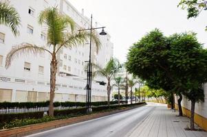Streets with architecture of the resort town buildings and tropical greenery. photo