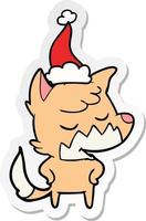 friendly sticker cartoon of a fox wearing santa hat vector