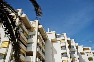 Streets with architecture of the resort town buildings and tropical greenery. photo