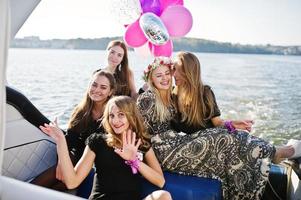 Girls having fun at yacht on hen party. photo