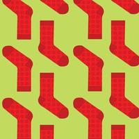 Pattern of vector colorful socks on a green background