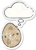 cartoon egg and thought bubble as a distressed worn sticker vector