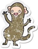 retro distressed sticker of a cartoon monkey vector