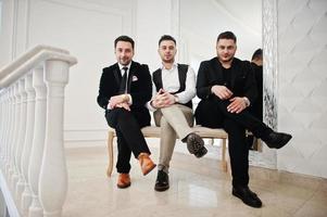 Three stylish bearded man well dressed posed. Musician band guys. photo