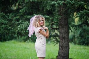 Portrait of blonde curly future bride at hen party. photo