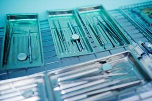 Close-up photo of a wide range of dental instrument in a special container.