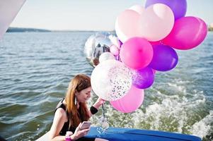 Girls having fun at yacht on hen party. photo