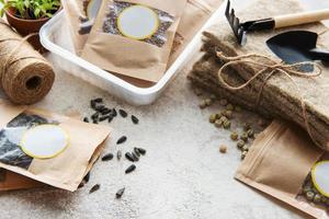 Microgreen seeds in paper bags and equipment for sowing microgreens. photo