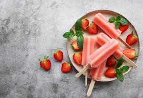 Strawberry ice cream popsicles photo