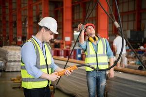 Two young engineers Testing and checking the operation of the semi gantry crane photo