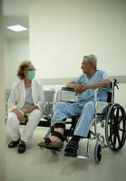 An elderly couple talked and looked at each other with love and care. photo