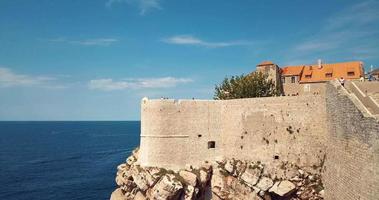 Aerial View to the Old City Fortification and Red Roofs in Dubrovnik, Croatia video