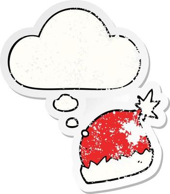 cartoon santa hat and thought bubble as a distressed worn sticker