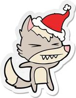 angry wolf sticker cartoon of a wearing santa hat vector