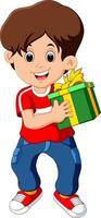 niño pequeño sosteniendo una caja de regalo vector