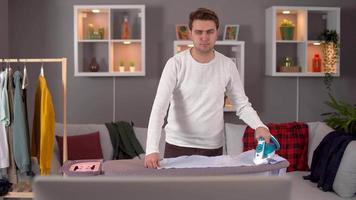 Young man ironing at home. timelapse. Student or young man ironing at home. video