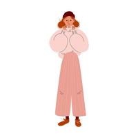 Nice girl in a big warm sweater, wide trousers, and brown lace-up shoes. Cartoon young woman in a brown hat and oversized jumper warms her hands. Vector stock illusion on a white background.