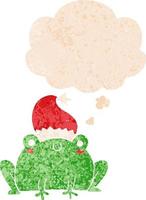 cute cartoon christmas frog and thought bubble in retro textured style vector