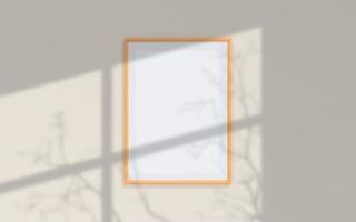 Clean and minimalist front view portrait wooden photo or poster frame mockup hanging on the wall with shadow overlay. 3d rendering.