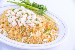 Crab fried rice on the white dish. Favorite food of Thailand. photo