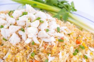 Crab fried rice on the white dish. Favorite food of Thailand. photo