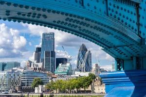 London, UK, 2014. View of modern architecture in the City from underneath Tower Bridge in London on August 22, 2014. Unidentified people photo