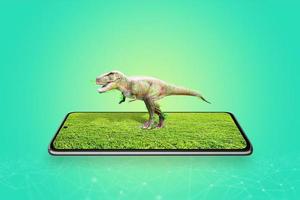 3d projection of a dinosaur from a mobile phone display concept. Augmented reality in education photo