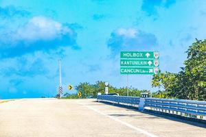 Cancun Quintana Roo Mexico 2021 Road sign at highway motorway in jungle tropical nature Mexico. photo