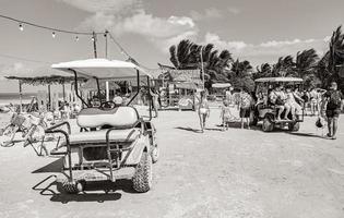 Holbox Quintana Roo Mexico 2021 Golf cart cars carts sandy muddy street beach Holbox Mexico. photo